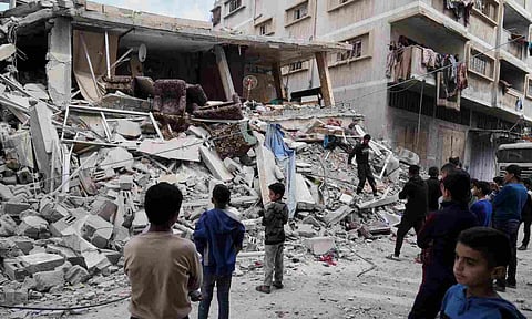 Palestinians inspect the damage after an Israeli army airstrike in Gaza City&nbsp; (AP)