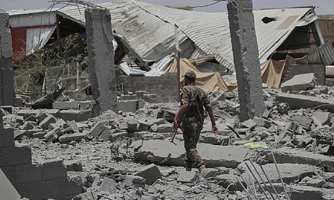 A Yemeni soldier inspects the damage reportedly caused by U.S. airstrikes in Sanaa, Yemen (AP)