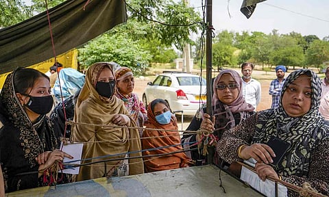 Stranded people, some holding Indian passports while their children have Pakistani passports, wait at the Integrated Check Post near the Attari-Wagah border, in Amritsar district, Friday, May 2, 2025 (PTI)&nbsp;
