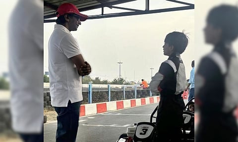 Former Formula One driver Narain Karthikeyan giving racing tips to actor Ajith Kumar's son Aadvik (IANS)