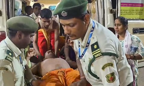 Police personnel carry an injured after a stampede during a temple festival, in Shirgao village, around 40 km away from Panaji, Goa, Saturday, May 3, 2025 (PTI)&nbsp;