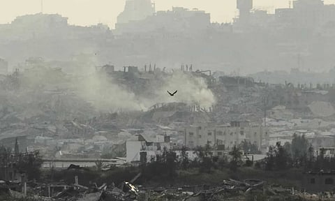Buildings that were destroyed during the Israeli ground and air operations in the Gaza Strip are seen from southern Israel (AP)