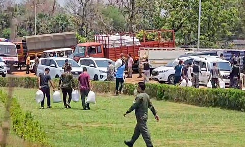 Security personnel carry water and food from an Indian Air Force helicopter for troops deployed on the Naxal front, in Bijapur, Chhattisgarh, Friday, April 25, 2025 (PTI)&nbsp;