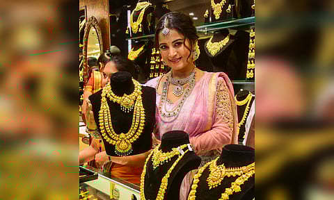 Kannada Actress Anusha Rai poses with gold jewellery on the occasion of Akshaya Tritiya, in Bengaluru, Wednesday, April 30, 2025. (PTI)
