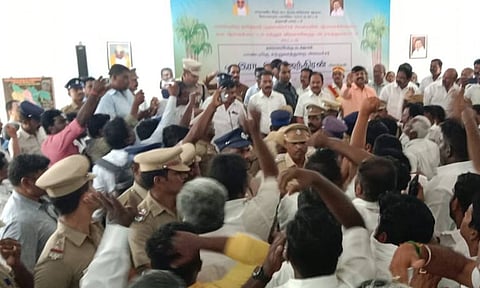 Police personnel removing two AIADMK MLAs and their supporters from the meeting hall in Dharmapuri&nbsp;