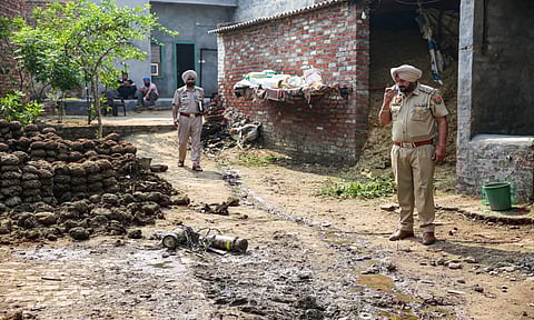 Jalandhar: A police personnel inspects the debris of an unidentified projectile which landed amid the conflict between India and Pakistan, in Jalandhar, Punjab, Saturday (PTI)