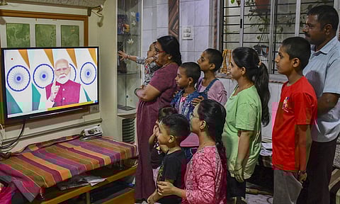 People watch the live telecast of Prime Minister Narendra Modi's address to the Nation, in Hubballi, Karnataka, Monday, May 12, 2025 (PTI)&nbsp;