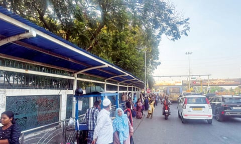 A crammed bus shelter at Wallajah Road on Anna Salai