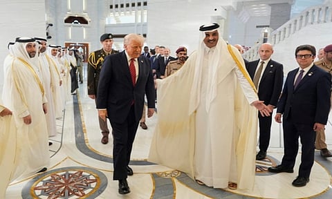 Qatar's Emir Sheikh Tamim bin Hamad Al Thani welcomes President Donald Trump during an official welcoming ceremony at the Amiri Diwan in Doha, Qatar, Wednesday, May 14, 2025. (AP)