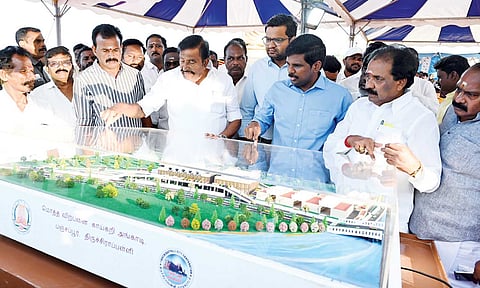 Municipal Administration Minister KN Nehru having a look at the model of the upcoming vegetable market at Panjappur IBT&nbsp;