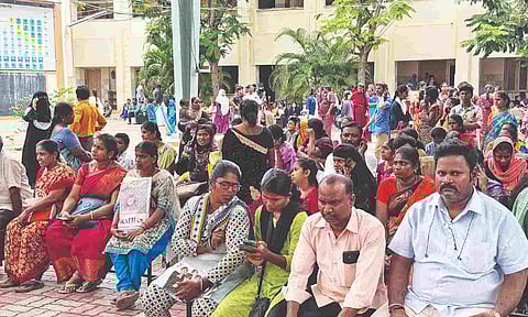 Parents and students await results at a school in Tiruchy