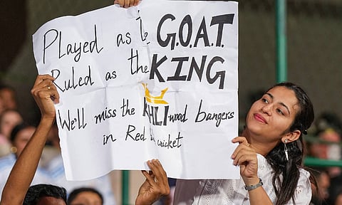 A fan holding a chart in Virat Kohli's honour after he recently announced retirement from the test cricket (PTI)