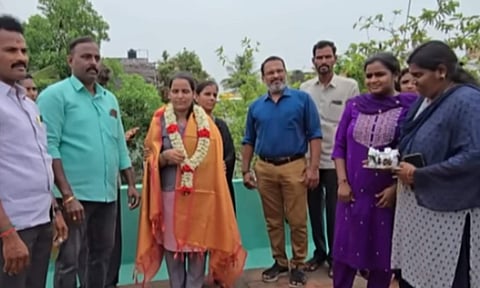 Teachers and neighbours draped shawls around her and cut a cake in her honour