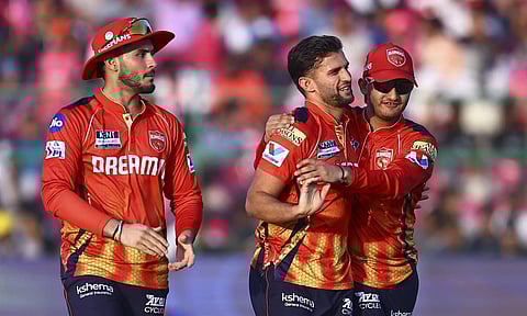 Punjab Kings' bowler Azmatullah Omarzai celebrates the wicket of Rajasthan Royals' batter Sanju Samson during the Indian Premier League (IPL) 2025 cricket match between Rajasthan Royals and Punjab Kings, at Sawai Mansingh Stadium, in Jaipur, Sunday, May 18, 2025 (PTI)&nbsp;