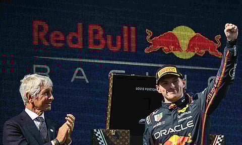 &nbsp;Max Verstappen atop the podium