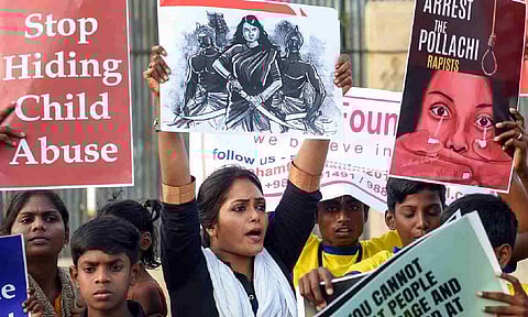 Members of various Tamil organisations hold placards and raise slogans during a protest against the Pollachi sexual assault case in Chennai, on 15 March 2019. (PTI)