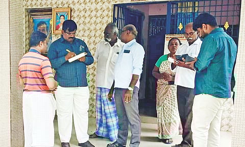 Officials conducting an inquiry during the searches on one of the premises