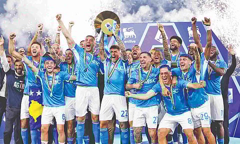 &nbsp;Napoli players celebrate after winning the title