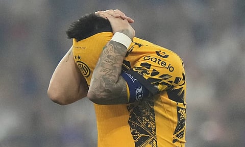 Inter Milan's team captain Lautaro Martinez reacts at the end of the Champions League final soccer match between Paris Saint-Germain and Inter Milan at the Allianz Arena in Munich (AP)