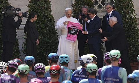 Pope Leo XIV receives a pink jersey from RCS president Urbano Cairo (AP)