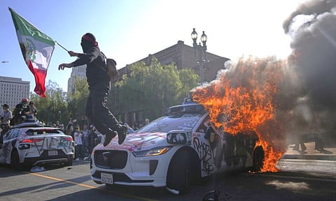 Vehicle set ablaze in protest, Los Angeles, (AP)
