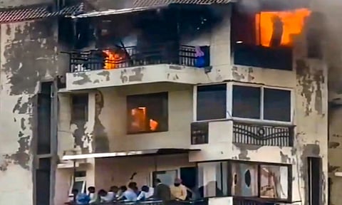 A building in the Shabad housing society where a fire broke out earlier in the day, at Dwarka. At least three people, including two children, were killed in the incident (PTI)