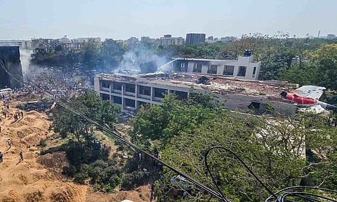 People gather at the site after an Air India plane crashed moments after taking off from the airport, in Ahmedabad (PTI)&nbsp;