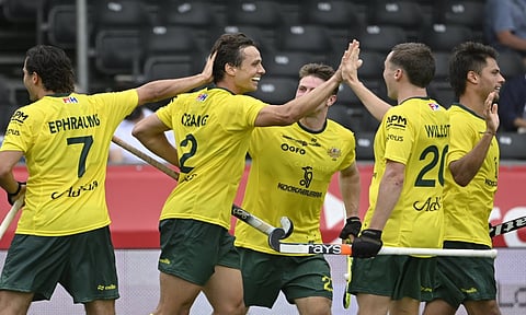 Tom Craig celebrates with teammates after scoring the winner