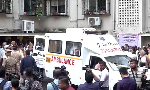 People gather as the mortal remains of Captain Sumeet Sabharwal, pilot of the Air India plane which crashed in Ahmedabad last week, are brought to Mumbai (PTI)