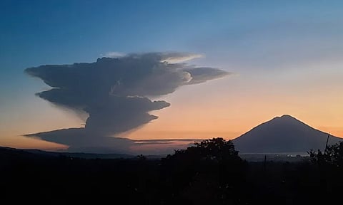 Volcanic smoke billows from Mount Lewotobi Laki-Laki during an eruption, as seen from Lembata, Indonesia (AP)