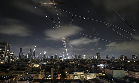 The Israeli Iron Dome air defense system fires to intercept missiles during an Iranian attack over Tel Aviv, Israel (AP)