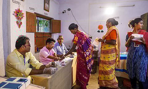 &nbsp;A voter makes a thumb impression before casting vote at a polling booth during the by-election to the Kaliganj assembly seat in West Bengal
