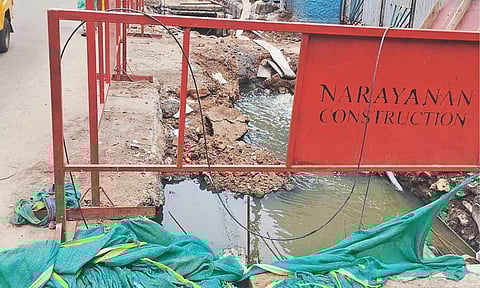 The open drain at the SWD construction site near Sir Thiyagraya College Metro Station