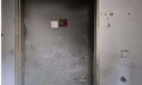 Bullet holes and smoke damage are seen in the bedroom of Ziv Berman, 26, in Kibbutz Kfar Aza, Israel, on Monday, June 24, 2024. Berman and his twin brother, Gali, re abducted on (AP)