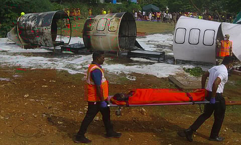 Personnel from various agencies taking part in an emergency exercise at the OTA simulating the crash of a passenger aircraft, on Saturday