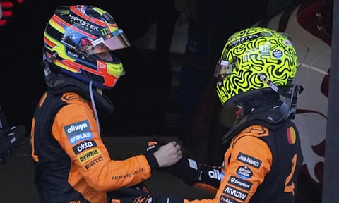 Oscar Piastri of Australia congratualtes the victory to McLaren driver Lando Norris (AP)&nbsp;