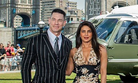 Actors John Cena, left, and Priyanka Chopra at the photocall of Prime Video movie 'Heads of State', in London (PTI)