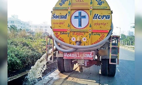 File photo of a tanker carrying sewage water and draining it along a roadside canal