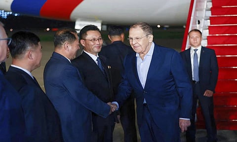 Russian Foreign Minister Sergey Lavrov, second right, shakes hands with North Korean officials upon his arrival at an airport outside Pyongyang, North Korea (AP)