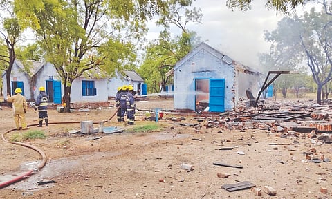 Firefighters dousing flames after an explosion in the cracker unit