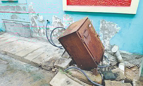 An EB box lying haphazardly with exposed live wires on the ground in Ramanathapuram