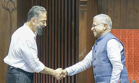 RS Deputy Chairman Harivansh Narayan Singh being greeted by Makkal Needhi Maiam leader Kamal Haasan (Credit: PTI)