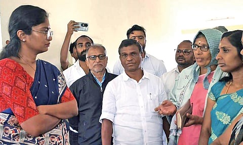 Nilgiris Collector Lakshmi Bhavya Tanneeru gives Gudalur villagers a patient on their grievances, on Friday