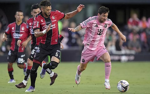 Inter Miami forward Lionel Messi, right, is pursued by Atlas defender Doria (5) during the first half of a Leagues Cup group stage soccer match, Wednesday, July 30, 2025, in Fort Lauderdale, Fla (AP)&nbsp;