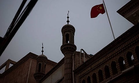 The Chinese national flag flies over a mosque in the old city in Kashgar, Xinjiang Uyghur Autonomous Region, China (Photo/ANI)