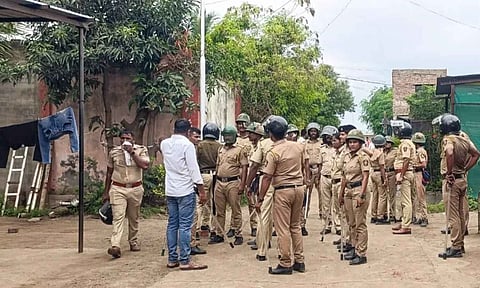 Security personnel keep vigil after two groups clashed over an alleged objectionable post on Friday, at Yavat in Pune's Daund tehsil (PTI)