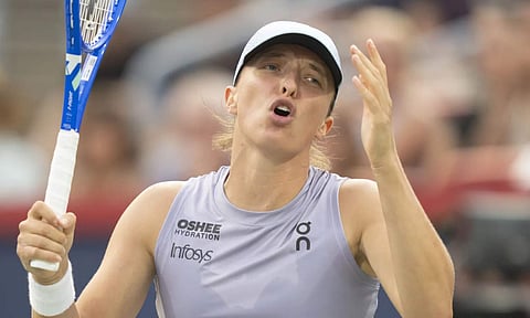 Iga Swiatek, of Poland, reacts during her match against Clara Tauson, of Denmark, during round of 16 action at the National Bank Open women's tennis tournament in Montreal, Sunday, Aug. 3, 2025. (AP)&nbsp;
