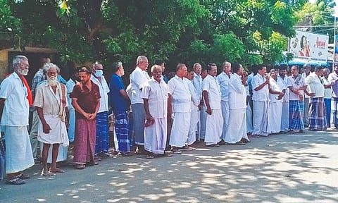 tipplers, staged a protest on Monday demanding to establish a Tasmac outlet in their locality as illegal sale of liquor has been prevailing in the village