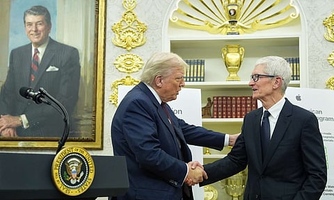 President Donald Trump shakes hands with Apple CEO Tim Cook in the Oval Office, Wednesday, Aug. 6, 2025, in Washington (AP)&nbsp;
