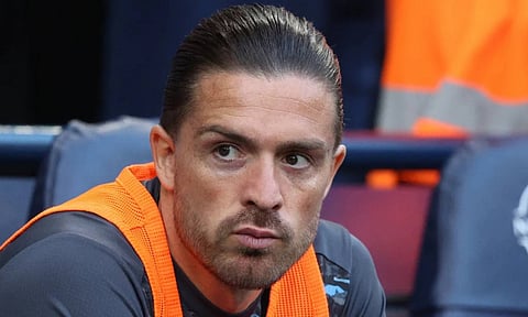 Jack Grealish on the bench during a match last season&nbsp;